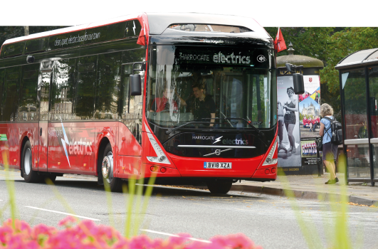 a harrogate bus on a road