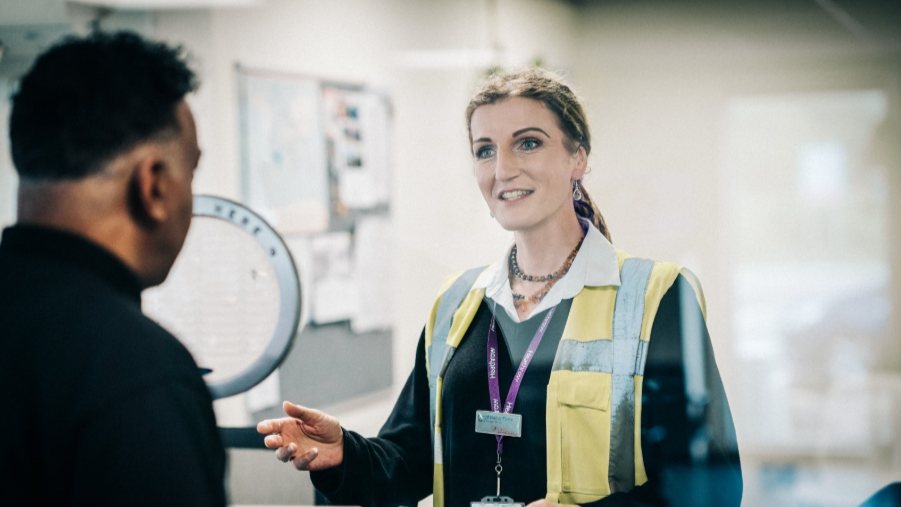 a woman talking to a customer for TAS